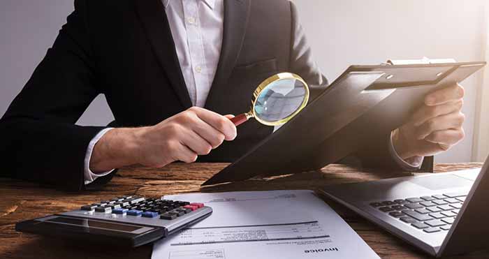 Magnifying glass over documents